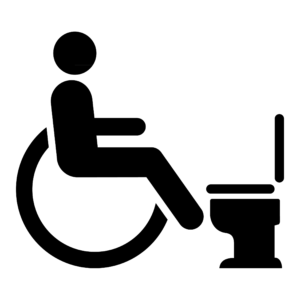 Dibujo en pictograma  de una persona en silla de ruedas en un aseo accesible