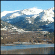 Valle de la Barranca con las cumbres de Bola del Mundo nevadas