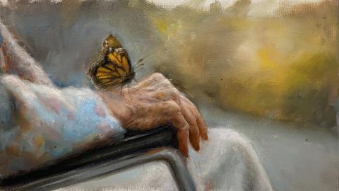 Pintura de Román Linacero. pintura de mano envejecida con una mariposa posada en ella