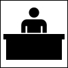 Icono mostrando a una persona detrás de un mostrador