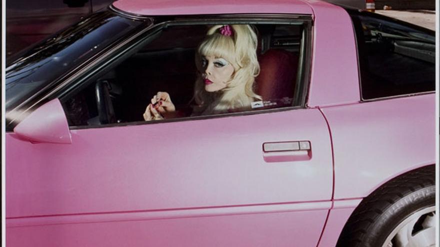 Blonde woman in sports car