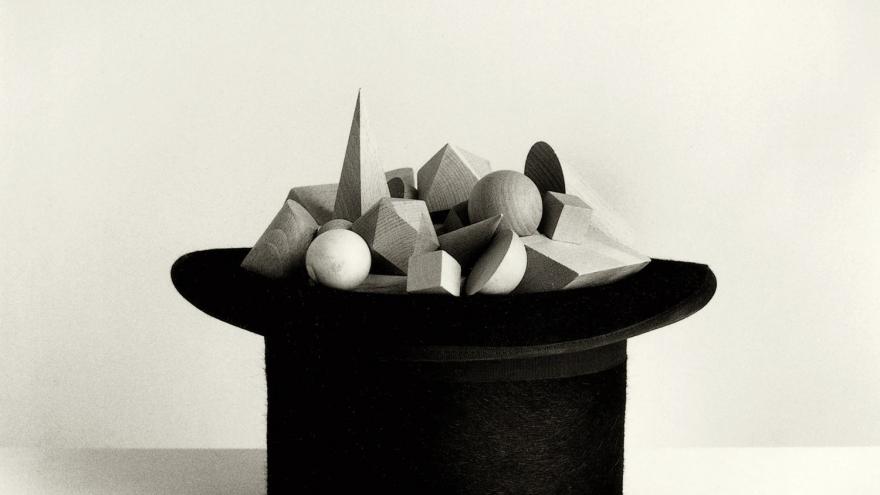 Top hat filled with geometric wooden figures