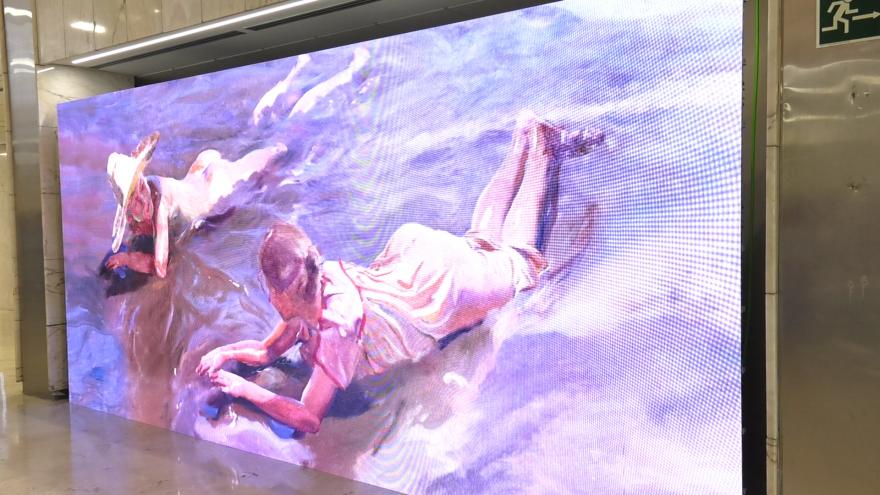 obra de Sorolla con mujer tumbada boca abajo en la orilla de la playa