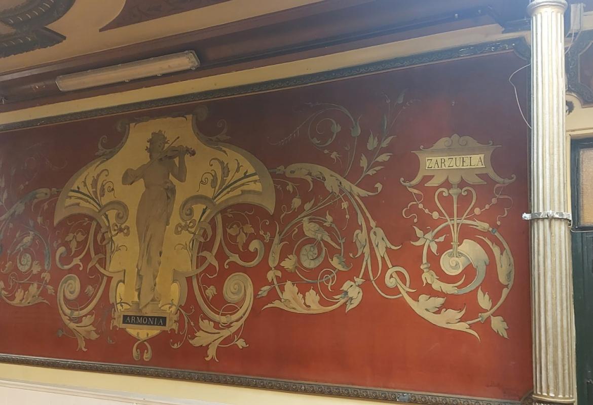 woman playing the violin on a golden background, plant decoration and inscriptions with the words Harmony, Opera and Zarzuela